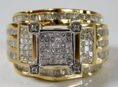 A large architectural 14ct gold ring set with appr