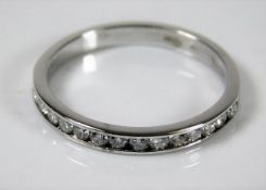 An 18ct white gold half eternity ring size O 2.3g