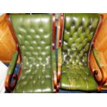 A pair of green leather Chesterfield rockers