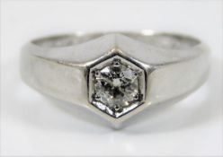 A 14ct white gold ring set with centre diamond of