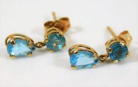 A pair of 10ct gold earrings set with blue stone 0