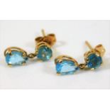 A pair of 10ct gold earrings set with blue stone 0