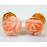 An 18ct gold pair of carved pink coral earrings de