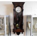 A mahogany cased Vienna wall clock with pendulum &