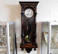 A mahogany cased Vienna wall clock with pendulum &