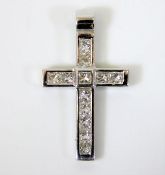 A white metal tests as 18ct gold cross set with approx. 1ct princess cut diamonds 4.4g