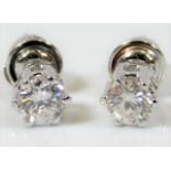 A pair of 18ct white gold earrings set with approx