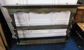 An 18thC. oak shelf unit. Provenance: From Tremato