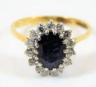 An 18ct gold ring set with sapphire & diamond 3.2g
