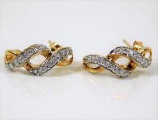 A pair of 9ct gold diamond earrings 2.7g