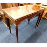 A mahogany card table with reeded legs. Provenance