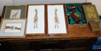 A quantity of giraffe related pictures & carvings
