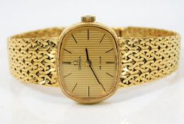 An 18ct gold ladies Omega De Ville wrist watch 34.