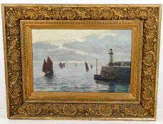 A gilt framed oil on panel depicting Newlyn harbou