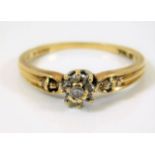 A 9ct gold ring set with white stones 2.1g size P