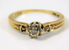 A 9ct gold ring set with white stones 2.1g size P