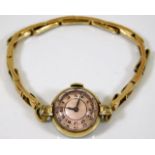 A vintage ladies gold plated wristwatch with facet