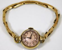 A vintage ladies gold plated wristwatch with facet