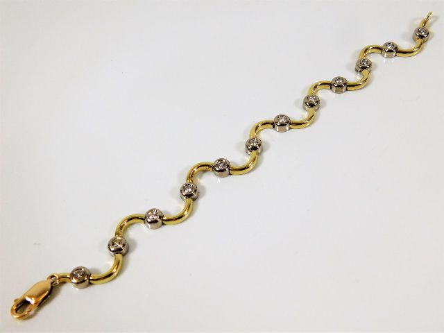 An 18ct gold bracelet set with sapphire & approx.