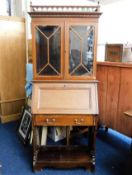 An Edwardian mahogany bureau bookcase with glazed