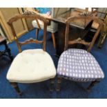 A pair of 19thC. walnut dining chairs with carved