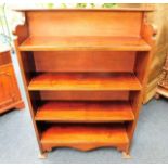 A mahogany floor standing bookcase twinned with a