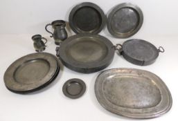 Two pewter plate warmers, a Victorian pewter tanka