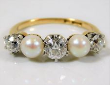 An antique 18ct gold ring set with 1.2ct of old cu