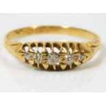An antique 18ct gold ring set with five old cut di