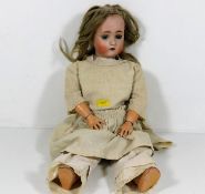 An early 20thC. doll