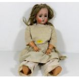 An early 20thC. doll