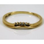 A 9ct gold ring set with small white stones 1.3g s
