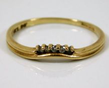 A 9ct gold ring set with small white stones 1.3g s