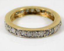 A 9ct gold eternity ring set with approx. 1ct diam