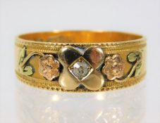 An 18ct three colour gold ring set with small diam