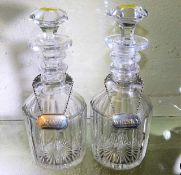 A pair of antique ring necked decanters with a pai