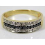 A 9ct gold ring set with 0.5ct diamond & sapphire