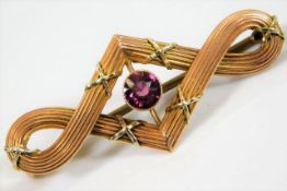 A 9ct two colour gold brooch set with pink tourmal
