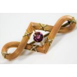 A 9ct two colour gold brooch set with pink tourmal