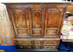 An impressive 18thC. oak livery cupboard with bras