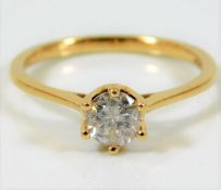 An 18ct gold ring with 0.6ct H colour certified di