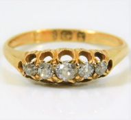 An 18ct gold antique ring set with five diamonds of approx. 0.4ct old cut 2.3g size L