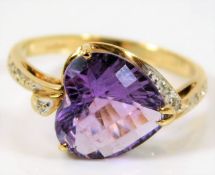 A 9ct gold ring set with heart shaped amethyst & d