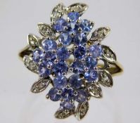 A 9ct gold ring set with blue & white stones 3.4g