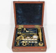 A Victorian boxed brass field microscope & slides