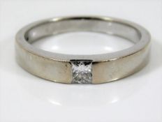 An 18ct white gold solitaire ring set with princes