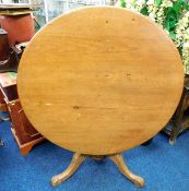 A 19thC. pine tilt top breakfast table