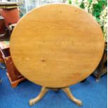 A 19thC. pine tilt top breakfast table