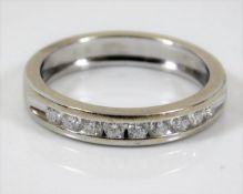 An 18ct white gold half eternity ring approx. 0.4c
