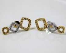 A pair of 18ct two colour gold diamond earrings 3.